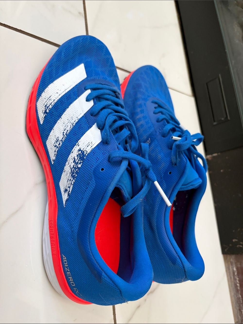 adidas Blue Athletic Running Shoes with White Stripes and Red Soles